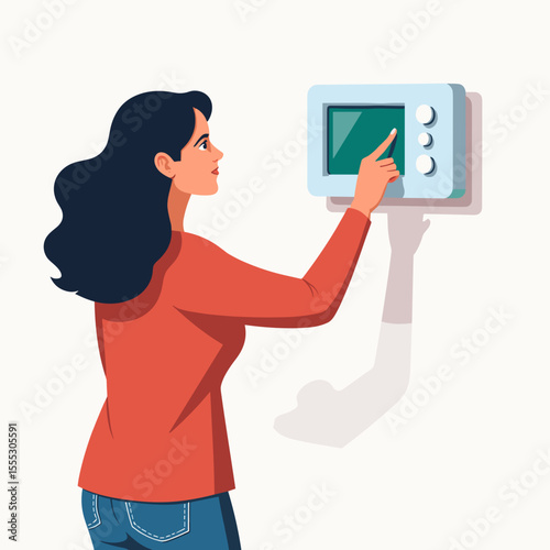 Young woman adjusting thermostat on wall in modern home  