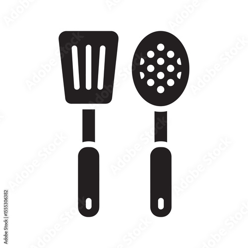 Kitchen utensil set icon with a slotted spatula and spoon for cooking serving and straining food a pair of common cooking tools vector solid glyph icon