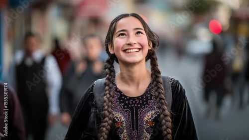 Wallpaper Mural Smiling girl with long braided hair on a city street. Torontodigital.ca