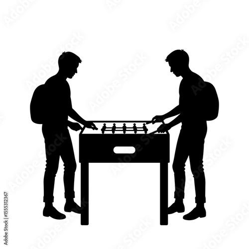 Two young men playing foosball game at airport concept of things to do in airport  