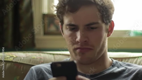 Frustrated Man Switching Between Apps on Smartphone