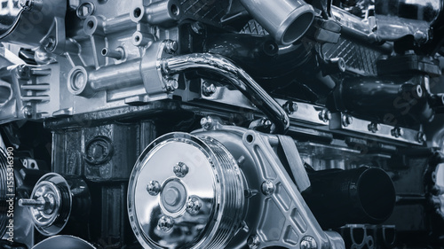 car engine with a lot of detail. The engine is made up of many parts, including a radiator, a muffler, and a fuel pump. Concept of complexity and intricacy