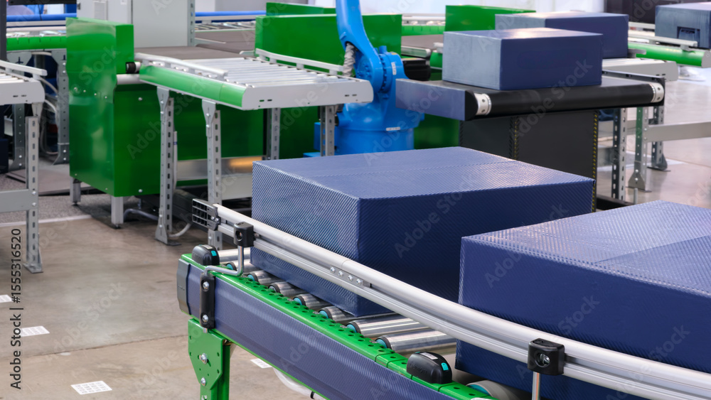 Naklejka premium Cardboard boxes on conveyor belt of modern distribution logistics center, delivery logistics concept background