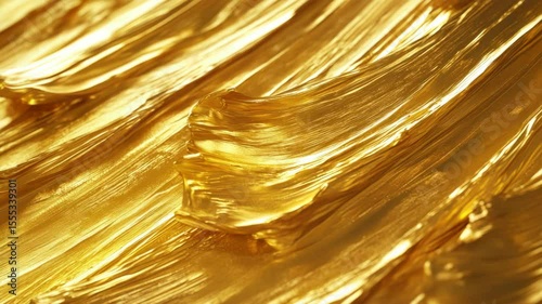 Lustrous gold foil material with refractive surfaces reflecting light and creating a diamond-like mesh pattern.