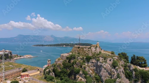 Aerial footage showcasing the majestic Old Fortress of Corfu, a historic Venetian citadel perched on a rocky peninsula overlooking the Ionian Sea