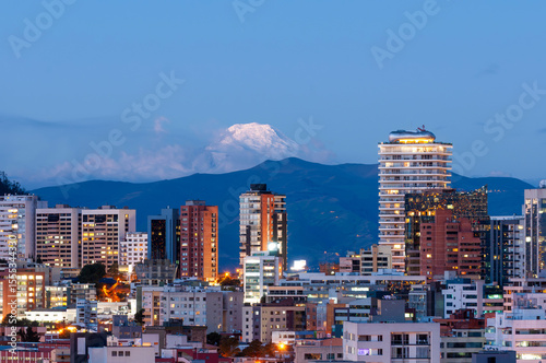 Sunset in Quito with the Cayambe Volcano in the background.
