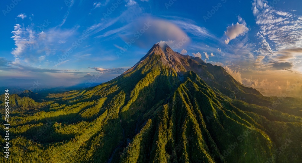 Naklejka premium Epic drone shot of active volcano view at sunrise. Morning panorama scenery of Merapi volcano