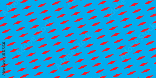 An artistic abstract design featuring red diamond shapes in a repeating pattern over a vivid blue backdrop, evoking creativity