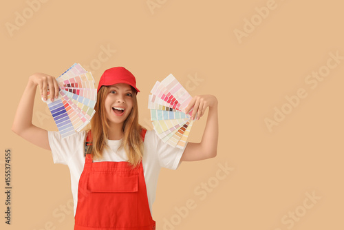 Happy female decorator with...