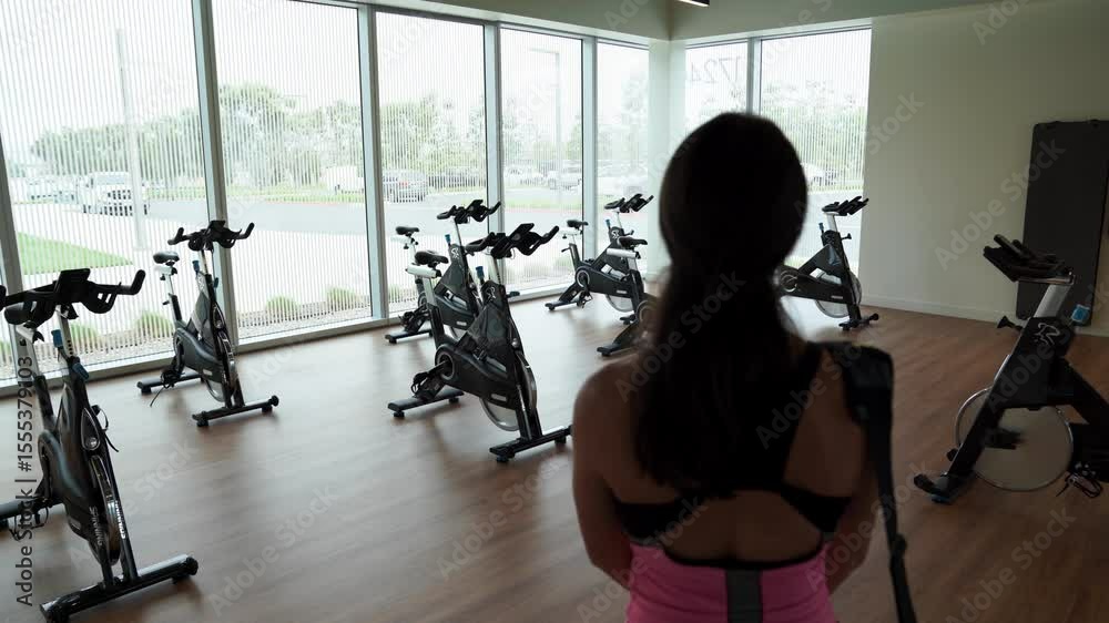 Woman walking into a fitness class