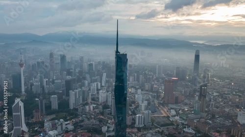 Wallpaper Mural Aerial view time lapse 4k video of Kuala Lumpur city center view during dawn overlooking the city skyline in Federal Territory, Malaysia. Tilt up Torontodigital.ca