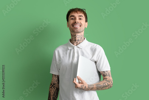 Happy young man with modern...