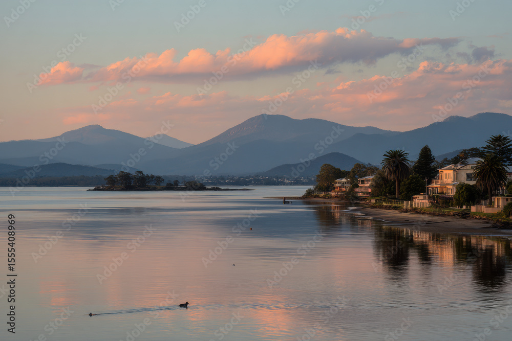 Fototapeta premium serene sunset over tranquil lake with solitary seagull gracefully floating on water