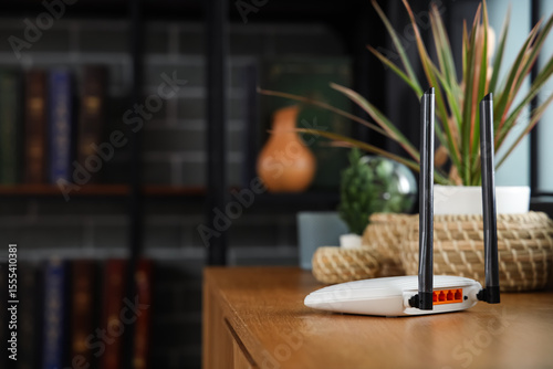 Modern wi-fi router on shel...