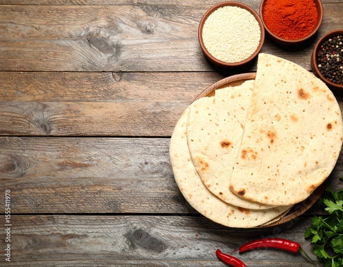 Indian naan bread on wooden desk