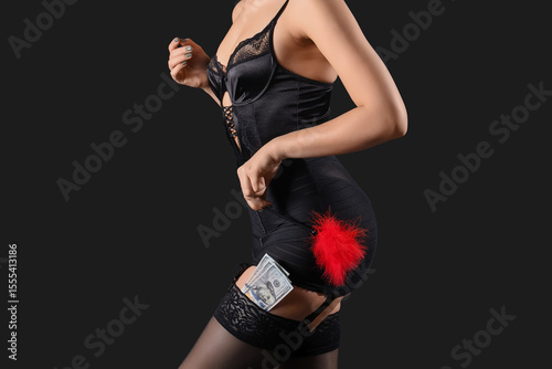 Young prostitute with feath...
