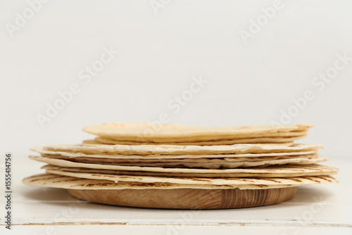 Stack of tasty lavash on wh...