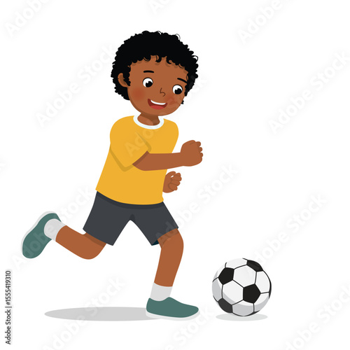 Little African boy playing football soccer ready to kick the ball