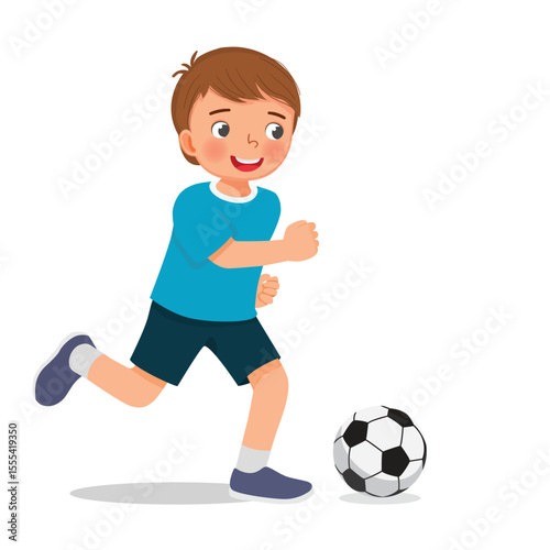 Little boy playing football soccer ready to kick the ball