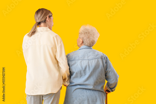 Senior woman with stick and...