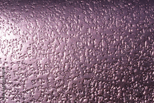 Purple metallic surface close-up abstract textured background