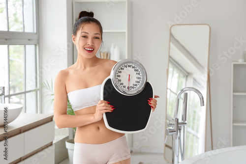Young Asian woman with weig...