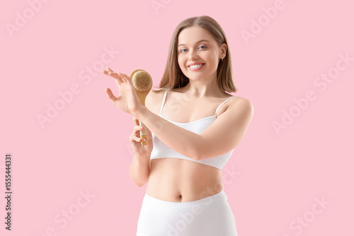 Young woman in underwear ma...