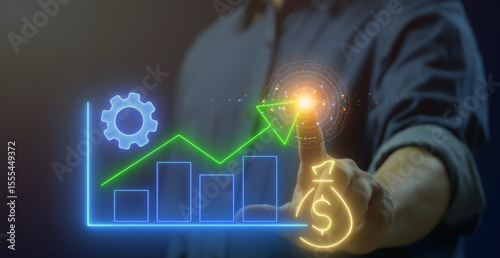 Business efficiency concept, how much a company or organization can produce as it relates to time, cost and quality. Businessman shows glowing neon line of profit maximization icon on virtual screen.