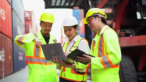 group of Diversity Engineers japan Foremen and asian Supervisors woman using laptop computer inspection Inventory in Shipping Cargo Container Terminal Depot teamwork talk logistics