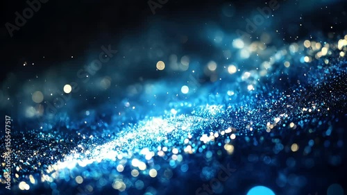 shimmering blue and gold particle wave with bokeh effect background