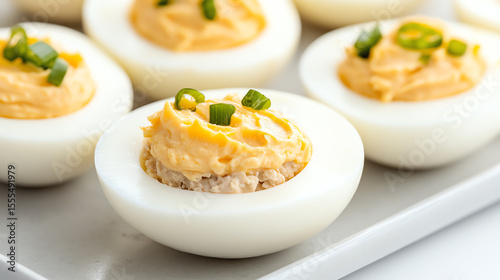 Delicious, creamy deviled eggs garnished with fresh chives, perfect for appetizers and gatherings.