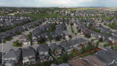 Aerial fly over of a suburban community on a stormy evening in Calgary Alberta. 