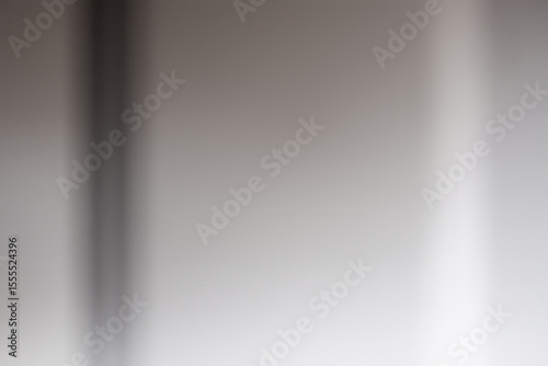 Abstract media of light and shadow on a flat surface.