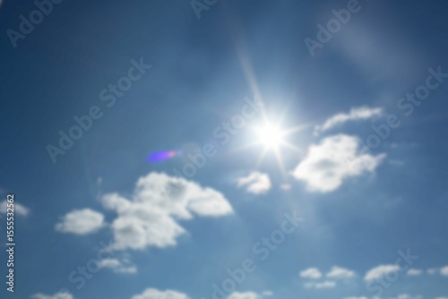 Low angle view of sunbeams with lens flare