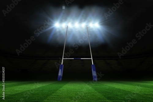 Rugby goalposts with blue pads are standing in flat design pitch under floodlights and striped turf photo