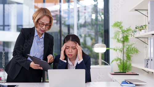 Fotografija Asian women stressed at work