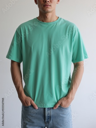 green t-shirt and blue jeans hands in pocket mockup