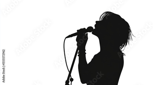Silhouette of a Woman Singing into a Microphone
