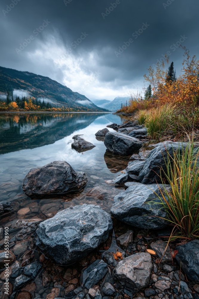 Fototapeta premium Calm lake reflecting autumn mountains