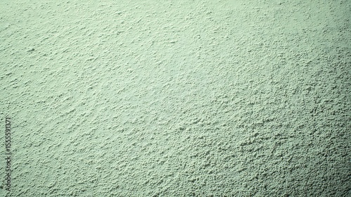 Textured green surface background with dimming effect