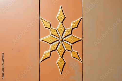 Embossed golden starburst on three vertical panels of earthy muted orange color
