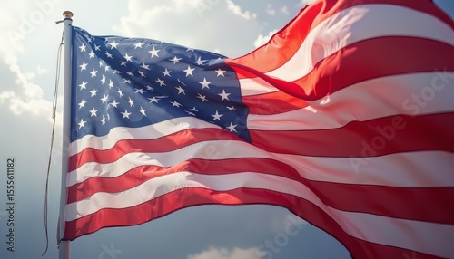 American Flag Waving Against Cloudy Sky