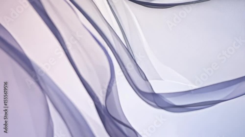 grey transparent fabric waving on the wind
