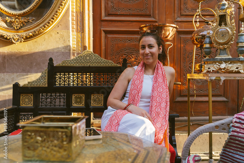 Tourist relaxing in a traditional arabic cafe in khan el khalili enjoying local atmosphere