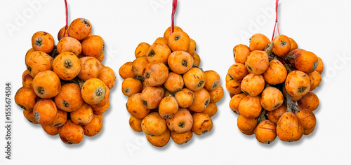 Loquat (Eriobotrya japonica) hanging outside a Chinese grocery store in San Francisco California,