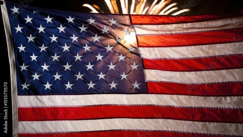 Waving American Flag Illuminated by Fireworks, Symbolizing Patriotism and Celebration in a Nighttime Display of National Pride