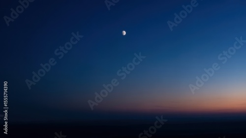 Serene evening sky with half moon at dusk