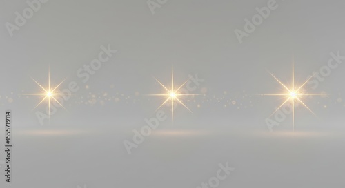 Golden Light Starbursts Sparkling on Grey Backdrop