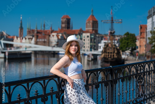 girl in a white hat on the background of the city of Gdansk Poland Europe