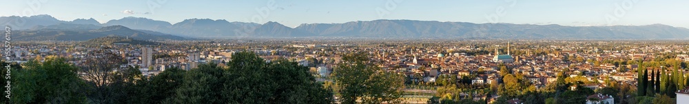 Obraz premium The Panorama of Vicenza in evening light wiht Alps in the background.